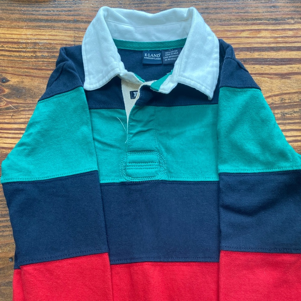ELand striped rugby shirt. 2 buttons with a cream colored collar.